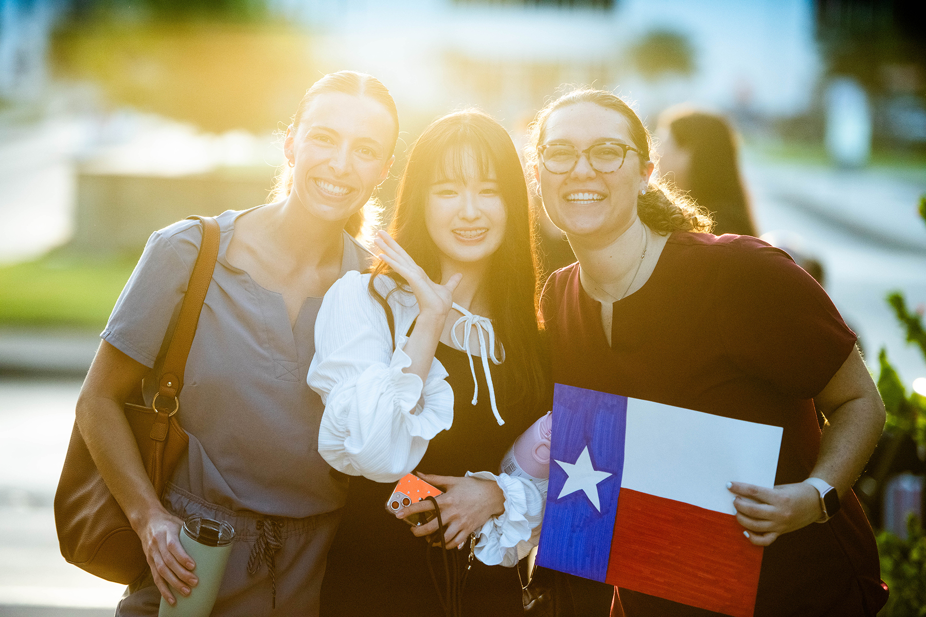 Students holding Texas flag